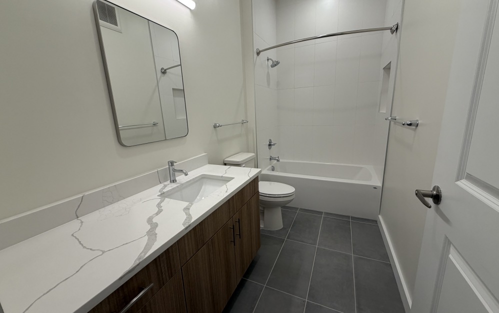 one bedroom apartment bathroom with storage