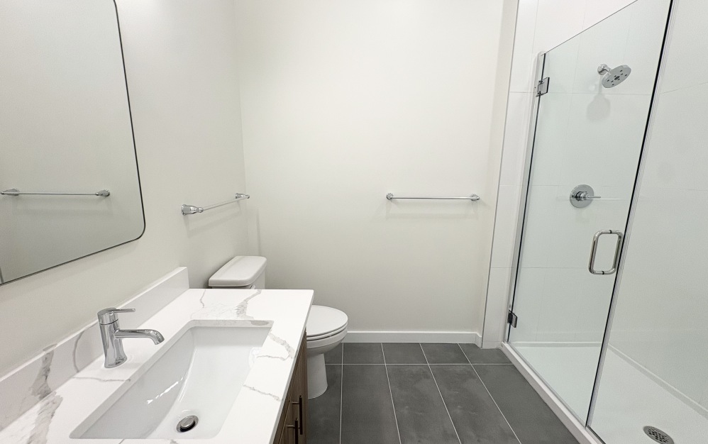 two bedroom bathroom with glass enclosed shower in downtown Richmond VA
