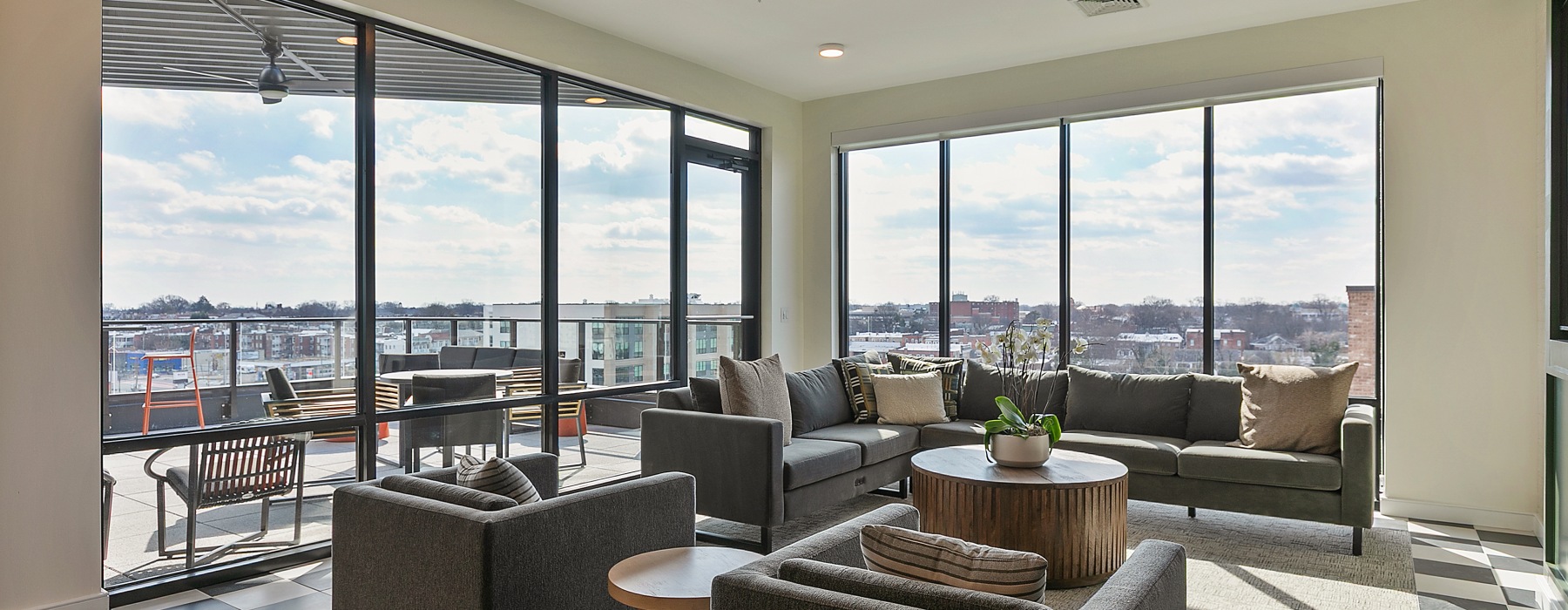 Clubroom with lounge chairs and view of city