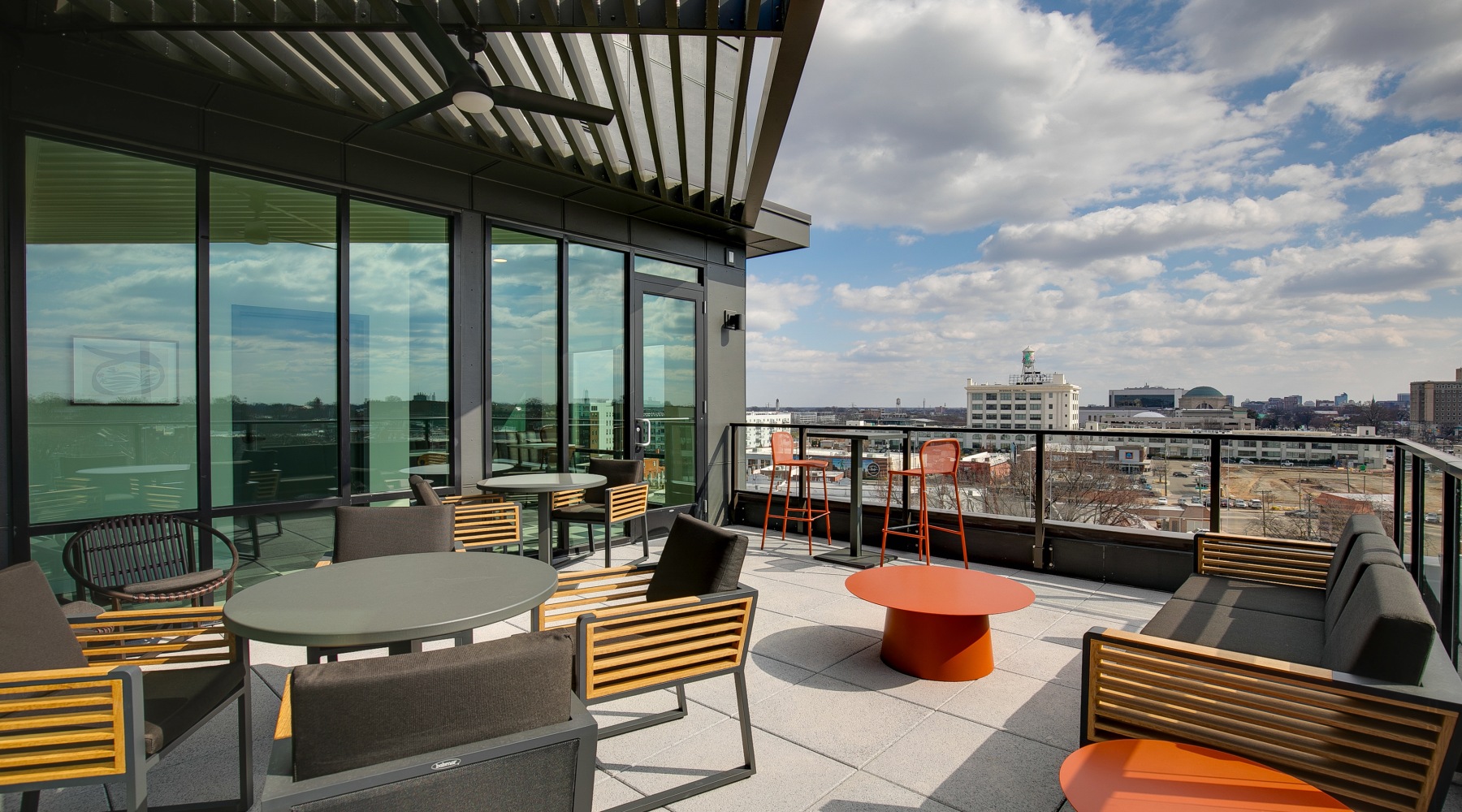 Rooftop deck with a seating areas and a view