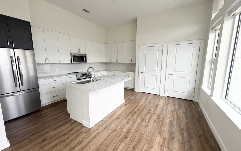 Townhome kitchen with natural light and storage