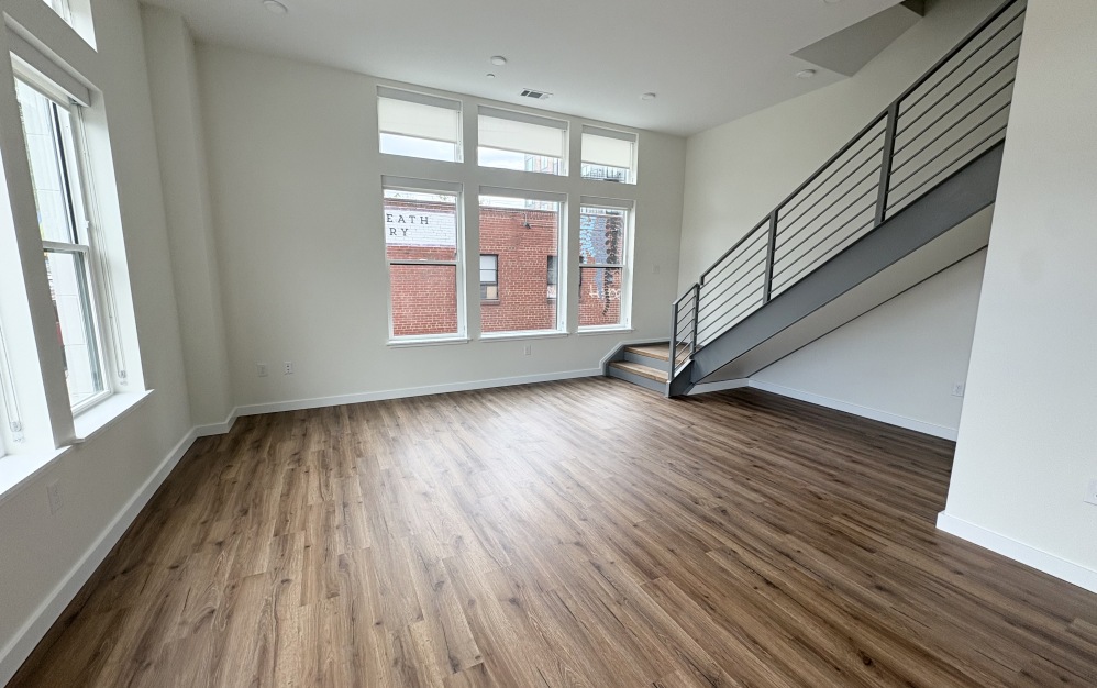 townhome living room with stairs to second level