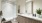 a bathroom with a glass shower a sink a toilet and mirrors